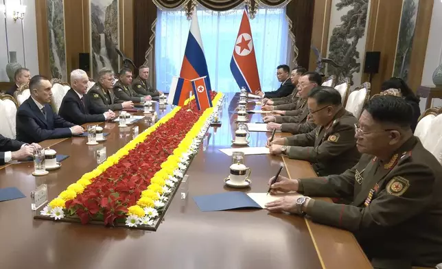 In this photo taken from a video released by Russian Defense Ministry press service, Russian Defense Minister Andrei Belousov, second left, speaks with North Korean Defense Minister No Kwang Chol, third right, during their meeting in Pyongyang, North Korea Friday, Nov. 29, 2024. (Russian Defense Ministry Press Service via AP)