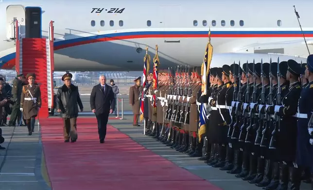 In this photo taken from a video released by Russian Defense Ministry press service, Russian Defense Minister Andrei Belousov, right on the red carpet, is welcomed by North Korean Defense Minister No Kwang Chol, left on the red carpet, upon his arrival at Pyongyang International Airport outside of Pyongyang, North Korea Friday, Nov. 29, 2024. (Russian Defense Press Service via AP)