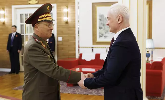 In this photo released by Russian Defense Ministry press service, North Korean Defense Minister No Kwang Chol, left, and Russian Defense Minister Andrei Belousov, right, shake hands during their meeting in Pyongyang, North Korea, Friday, Nov. 29, 2024. (Vadim Savitsky, Russian Defense Ministry Press Service via AP)