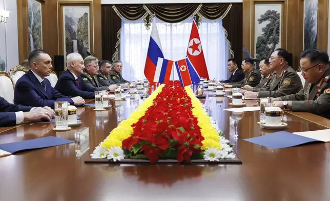 In this photo released by Russian Defense Ministry Press Service, Russian Defense Minister Andrei Belousov, second left, speaks with North Korean Defense Minister No Kwang Chol, second right, during their meeting in Pyongyang, North Korea, Friday, Nov. 29, 2024. (Vadim Savitsky, Russian Defense Ministry Press Service via AP)