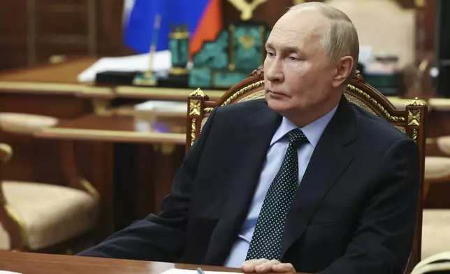 Russian President Vladimir Putin listens to Moscow-appointed head of Russian-controlled Zaporizhzhia region of Ukraine, Yevgeny Balitsky during their meeting at the Kremlin in Moscow, Russia, Monday, Nov. 18, 2024. (Vyacheslav Prokofyev, Sputnik, Kremlin Pool Photo via AP)