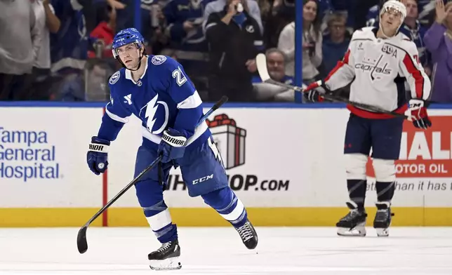 Tampa Bay Lightning center Brayden Point (21) celebrates his second goal during the first period of an NHL hockey game against the Washington Capitals, Wednesday, Nov. 27, 2024, in Tampa, Fla. (AP Photo/Jason Behnken)