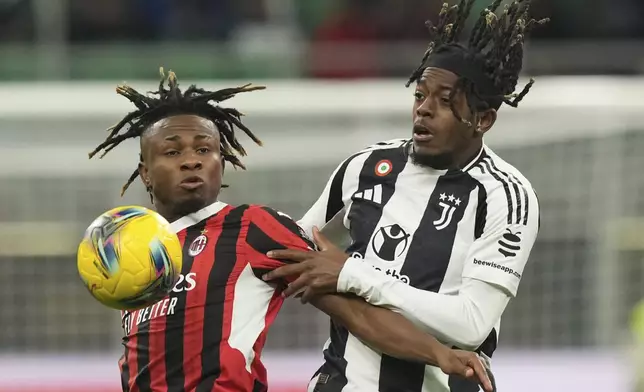 AC Milan's Samuel Chukwueze, left, and Juventus' Samuel Mbangula jump for the ball during the Serie A soccer match between AC Milan and Juventus at the San Siro stadium in Milan, Italy, Saturday, Nov. 23, 2024. (AP Photo/Antonio Calanni)