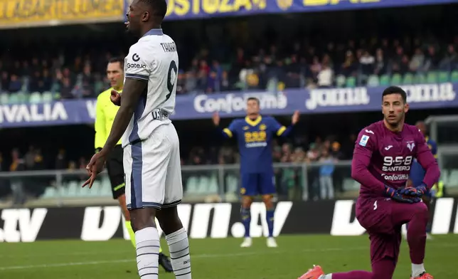 Inter Milan's Marcus Thuram, left, celebrates scoring during the Serie A soccer match between Hellas Verona and Inter Milan at the Marcantonio Bentegodi Stadium, in Verona, Italy, Saturday, Nov. 23, 2024. (Paola Garbuio/LaPresse via AP)