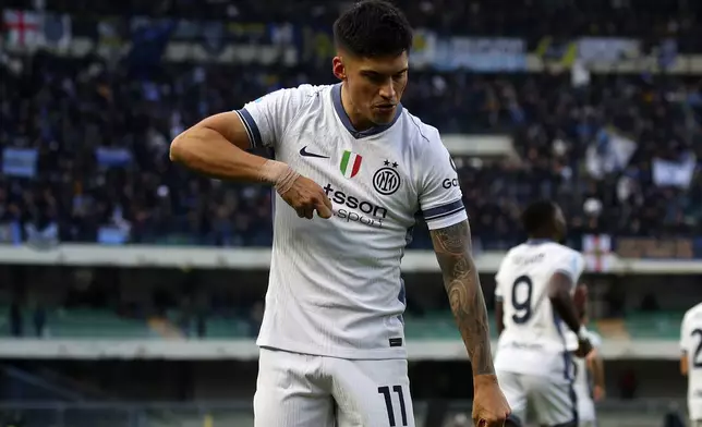 Inter Milan's Joaquin Correa celebrates scoring during the Serie A soccer match between Hellas Verona and Inter Milan at the Marcantonio Bentegodi Stadium, in Verona, Italy, Saturday, Nov. 23, 2024. (Paola Garbuio/LaPresse via AP)