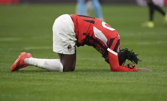 AC Milan's Rafael Leao crouches at the end of the Serie A soccer match between AC Milan and Juventus at the San Siro stadium in Milan, Italy, Saturday, Nov. 23, 2024. (AP Photo/Antonio Calanni)