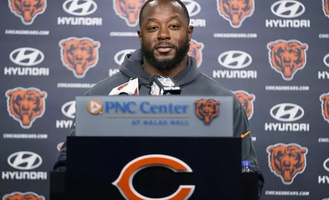 Chicago Bears new offensive coordinator Thomas Brown smiles as he listens to reporters during an NFL football news conference at Halas Hall in Lake Forest, Ill., Wednesday, Nov. 13, 2024. (AP Photo/Nam Y. Huh)