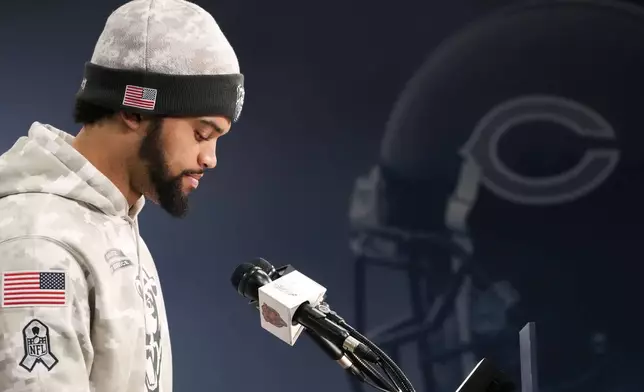 Chicago Bears quarterback Caleb Williams looks down as he listens to reporters during an NFL football news conference, Wednesday, Nov. 13, 2024, at Halas Hall in Lake Forest, Ill. (AP Photo/Nam Y. Huh)