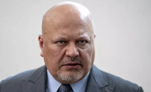 FILE - Karim Khan, Prosecutor of the International Criminal Court looks up prior to a press conference in The Hague, Netherlands, Monday, July 3, 2023. (AP Photo/Peter Dejong, File)