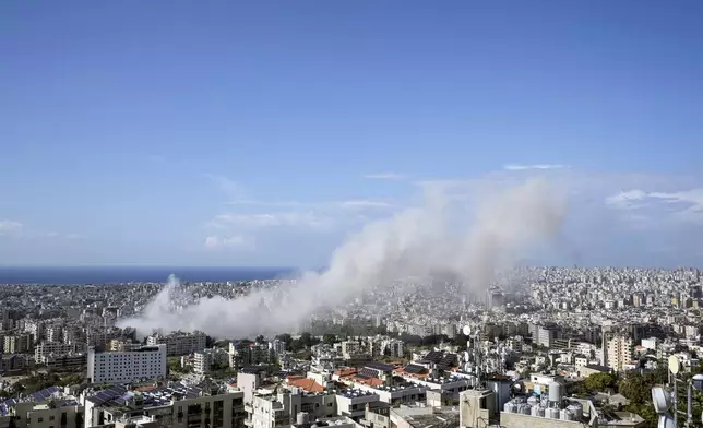 Smoke rises after an Israeli airstrike on Dahiyeh, in the southern suburb of Beirut, Lebanon, Thursday, Nov. 21, 2024. (AP Photo/Bilal Hussein)