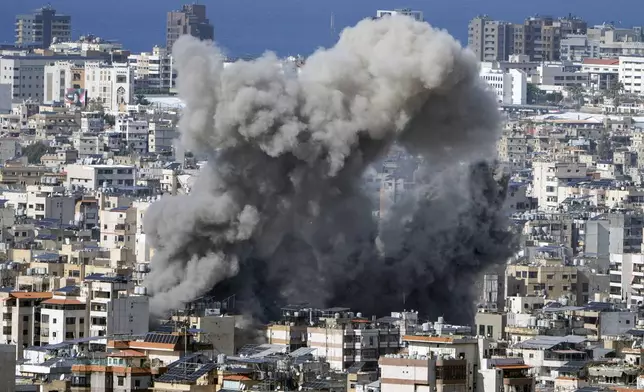 Smoke rises after an Israeli airstrike on Dahiyeh, in the southern suburb of Beirut, Lebanon, Thursday, Nov. 21, 2024. (AP Photo/Bilal Hussein)