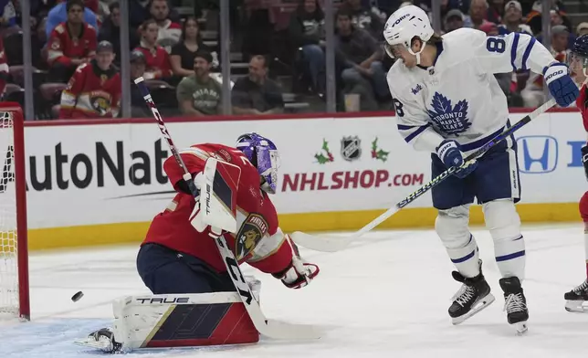 Toronto Maple Leafs right wing William Nylander (88) attempts a shot on the goal against Florida Panthers goaltender Sergei Bobrovsky, left, during the first period of an NHL hockey game, Wednesday, Nov. 27, 2024, in Sunrise, Fla. (AP Photo/Lynne Sladky)