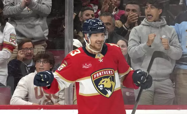 Florida Panthers center Sam Reinhart (13) reacts after scoring a goal during the second period of an NHL hockey game against the Toronto Maple Leafs, Wednesday, Nov. 27, 2024, in Sunrise, Fla. (AP Photo/Lynne Sladky)