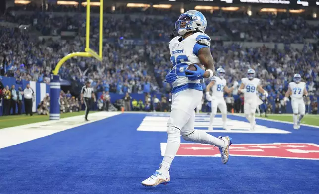 Detroit Lions running back Jahmyr Gibbs (26) runs into the endzone for a 1-yard rushing touchdown during the first half of an NFL football game against the Indianapolis Colts, Sunday, Nov. 24, 2024, in Indianapolis. (AP Photo/AJ Mast)