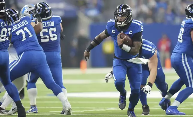 Indianapolis Colts quarterback Anthony Richardson scrambles during the first half of an NFL football game against the Detroit Lions, Sunday, Nov. 24, 2024, in Indianapolis. (AP Photo/AJ Mast)