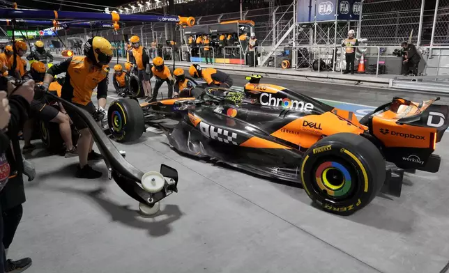 McLaren driver Lando Norris, of Britain, makes a pit stop in the garage area during a practice session for the Formula One U.S. Grand Prix auto race, Thursday, Nov. 21, 2024, in Las Vegas. (AP Photo/Matt York)