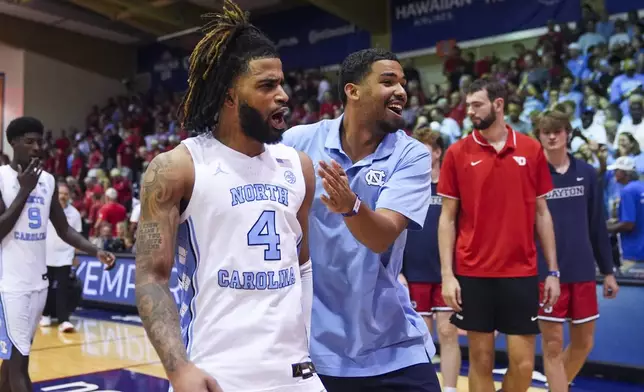 North Carolina guard RJ Davis celebrates a 92-90 win over Dayton in an NCAA college basketball game at the Maui Invitational Monday, Nov. 25, 2024, in Lahaina, Hawaii. (AP Photo/Lindsey Wasson)