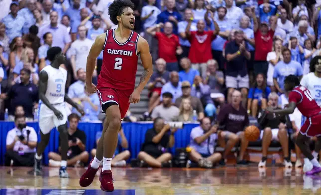 Dayton forward Nate Santos (2) reacts after tying the game against North Carolina during the second half of an NCAA college basketball game at the Maui Invitational Monday, Nov. 25, 2024, in Lahaina, Hawaii. (AP Photo/Lindsey Wasson)