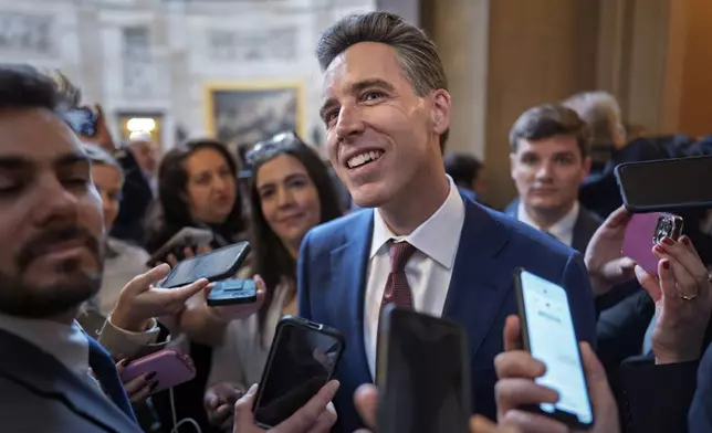 Sen. Josh Hawley, R-Mo., a member of the Senate Judiciary Committee, comments to reporters after meeting in private with former Rep. Matt Gaetz, R-Fla., President-elect Donald Trump's nominee to be attorney general, at the Capitol in Washington, Wednesday, Nov. 20, 2024. (AP Photo/J. Scott Applewhite)