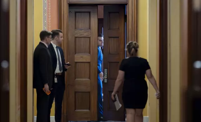 President-elect Donald Trump's nominee to be attorney general, former Rep. Matt Gaetz, R-Fla., closes a door to a private meeting with Vice President-elect JD Vance and Republican Senate Judiciary Committee members, at the Capitol in Washington, Wednesday, Nov. 20, 2024. (AP Photo/J. Scott Applewhite)