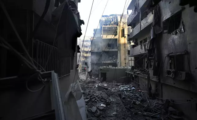 Destroyed buildings are seen at the site of an Israeli airstrike that hit central Beirut, Lebanon, Saturday, Nov. 23, 2024. (AP Photo/Hassan Ammar)