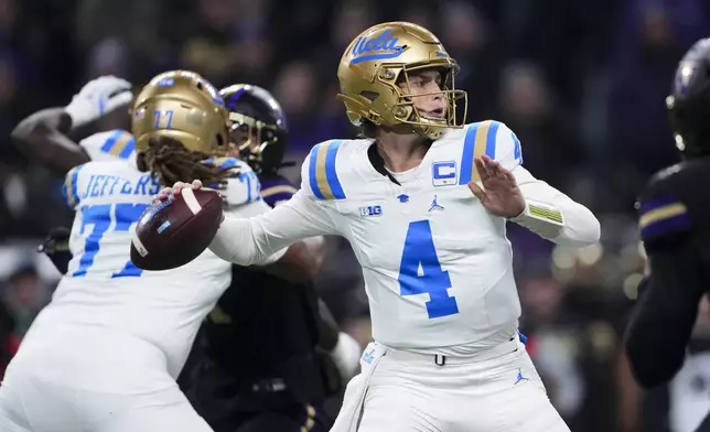 UCLA quarterback Ethan Garbers looks to throw against Washington during the first half of an NCAA college football game Friday, Nov. 15, 2024, in Seattle. (AP Photo/Lindsey Wasson)