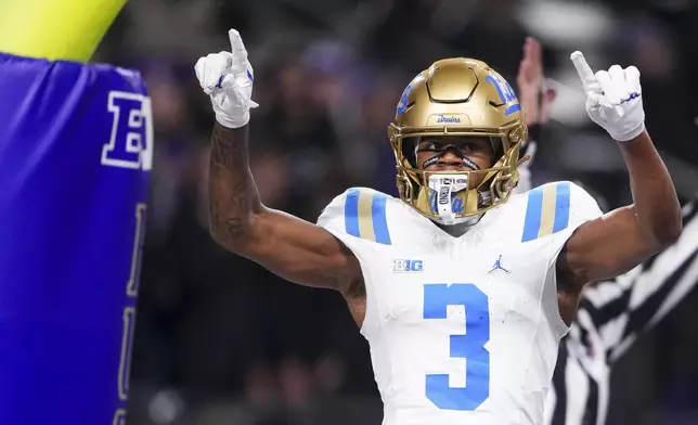 UCLA wide receiver Kwazi Gilmer (3) reacts to scoring a touchdown against Washington during the first half of an NCAA college football game Friday, Nov. 15, 2024, in Seattle. (AP Photo/Lindsey Wasson)