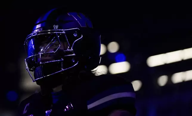 Washington safety Kamren Fabiculanan walks out to the field before an NCAA college football game against UCLA, Friday, Nov. 15, 2024, in Seattle. (AP Photo/Lindsey Wasson)