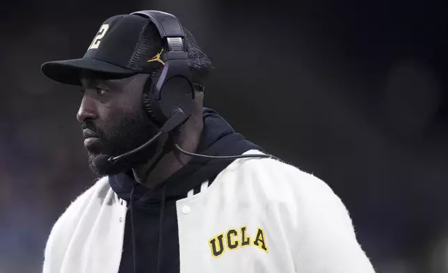 UCLA head coach DeShaun Foster looks on from the sideline against Washington during the first half of an NCAA college football game Friday, Nov. 15, 2024, in Seattle. (AP Photo/Lindsey Wasson)