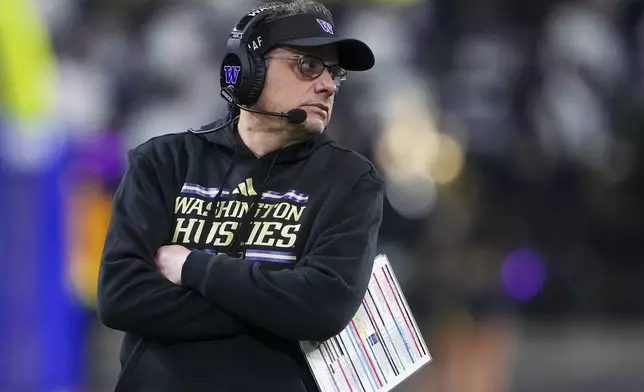 Washington head coach Jedd Fisch stands on the sideline during the first half of an NCAA college football game against UCLA, Friday, Nov. 15, 2024, in Seattle. (AP Photo/Lindsey Wasson)