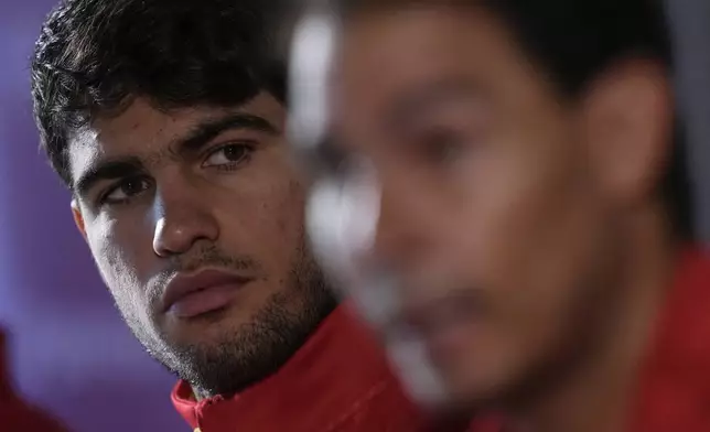 Spain's tennis player Carlos Alcaraz, left, and Rafael Nadal attends a press conference in Fuengirola, southern Spain, on Monday, Nov. 18, 2024. (AP Photo/Manu Fernandez)