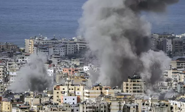 Smoke rises after an Israeli airstrike on Dahiyeh, in the southern suburb of Beirut, Lebanon, Monday, Nov. 25, 2024. (AP Photo/Bilal Hussein)