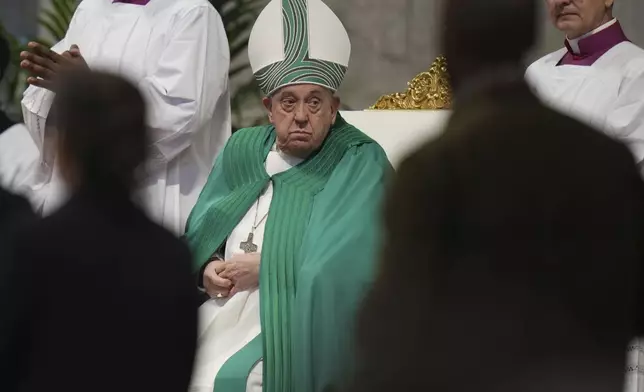 Pope Francis presides over a mass on the occasion of the World Day of the Poor in St. Peter's Basilica, at the Vatican, Sunday, Nov. 17, 2024. (AP Photo/Alessandra Tarantino)