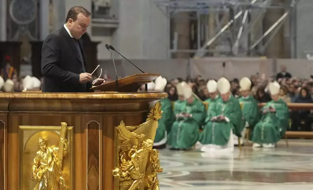 Abel Eduardo Balbo, former soccer player from Argentina, reads during a mass presided by Pope Francis on the occasion of the World Day of the Poor in St. Peter's Basilica, at the Vatican, Sunday, Nov. 17, 2024. (AP Photo/Alessandra Tarantino)