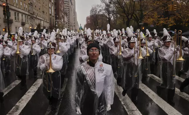 The University of Massachusetts Minutemen marching band marches down Central Park West while participating in the Macy's Thanksgiving Day Parade, Thursday, Nov. 28, 2024, in New York. (AP Photo/Yuki Iwamura)