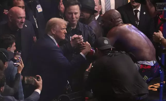 President-elect Donald Trump greets Jon Jones after he defeated Stipe Miocic at UFC 309 at Madison Square Garden, early Sunday, Nov. 17, 2024, in New York. (AP Photo/Evan Vucci)