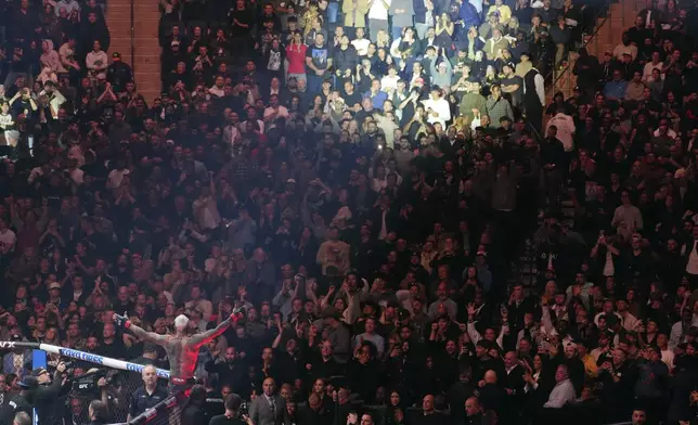 Brazil's Charles Oliveira reacts after his fight against Michael Chandler as President-elect Donald Trump attends UFC 309 at Madison Square Garden, early Sunday, Nov. 17, 2024, in New York. (AP Photo/Evan Vucci)