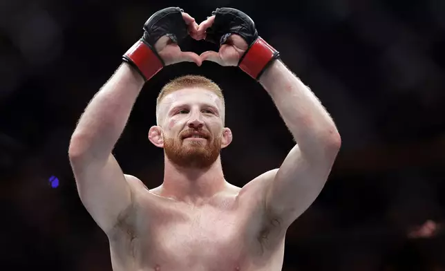 Bo Nickal reacts after defeating Scotland's Paul Craig in a UFC 309 mixed martial arts middleweight title bout, Saturday, Nov. 16, 2024, in New York. (AP Photo/Adam Hunger)