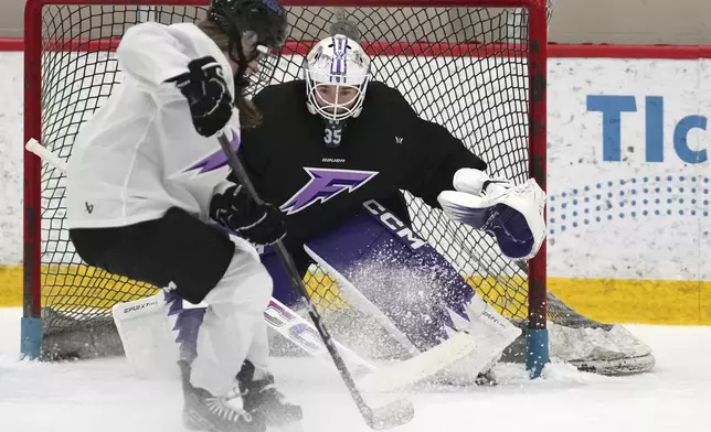 Minnesota Frost goaltender Maddie Rooney (35) tracks the puck during a PWHL hockey practice Thursday, Nov. 14, 2024 at TRIA Rink in St. Paul, Minn. (Anthony Souffle/Star Tribune via AP)