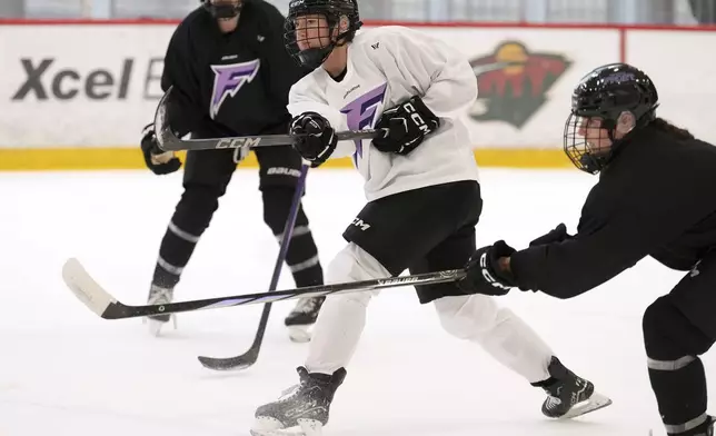 Minnesota Frost forward Grace Zumwinkle (13) shoots the puck during a PWHL hockey practice Thursday, Nov. 14, 2024 at TRIA Rink in St. Paul, Minn. (Anthony Souffle/Star Tribune via AP)