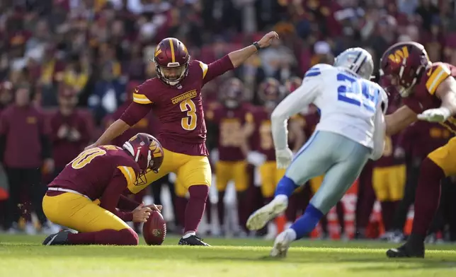 Washington Commanders place kicker Austin Seibert (3) kicks a 41-yard field goal during the first half of an NFL football game against the Dallas Cowboys, Sunday, Nov. 24, 2024, in Landover, Md. (AP Photo/Stephanie Scarbrough)