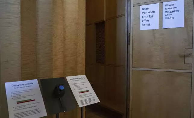 An experimental art installation with an AI Jesus entitled, Deus in Machina, installed in a confessional in St. Peter's Chapel in the old town of Lucerne, Switzerland, Sunday, Aug. 25, 2024. (Urs Flueeler/Keystone via AP)