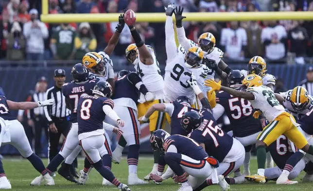 Green Bay Packers' Karl Brooks blocks a field goal attempt of Chicago Bears' Cairo Santos during the second half of an NFL football game Sunday, Nov. 17, 2024, in Chicago. The Packers won 20-19. (AP Photo/Charles Rex Arbogast)