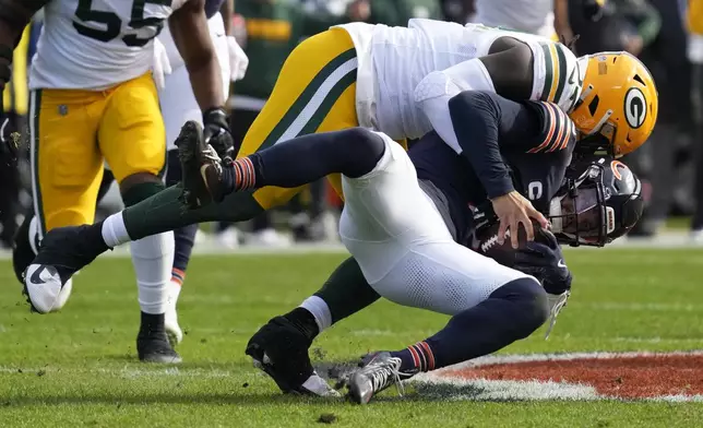 Green Bay Packers' Brenton Cox Jr. sacks Chicago Bears' Caleb Williams during the first half of an NFL football game Sunday, Nov. 17, 2024, in Chicago. (AP Photo/Nam Y. Huh)