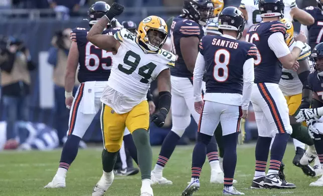 Green Bay Packers defensive end Karl Brooks (94) celebrates after blocking a winning field goal attempt by Chicago Bears place kicker Cairo Santos late in the second half of an NFL football game Sunday, Nov. 17, 2024, in Chicago. (AP Photo/Charles Rex Arbogast)