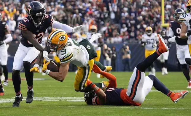 Chicago Bears' Kyler Gordon tackles Green Bay Packers' Christian Watson after a catch during the second half of an NFL football game Sunday, Nov. 17, 2024, in Chicago. (AP Photo/Nam Y. Huh)