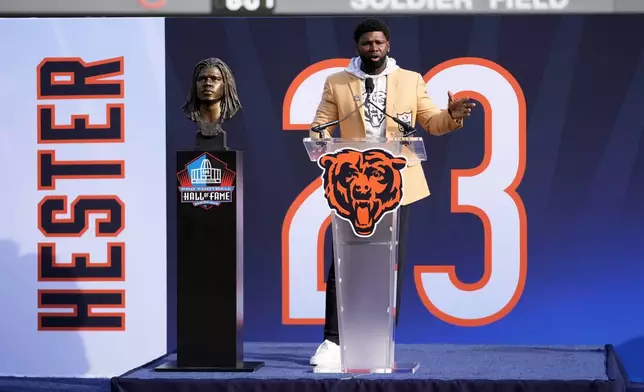 Former Chicago Bears Devin Hester speaks during a halftime ceremony of an NFL football game between the Chiicago Bears and Green Bay Packers Sunday, Nov. 17, 2024, in Chicago. (AP Photo/Charles Rex Arbogast)