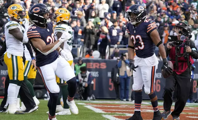 Chicago Bears' Roschon Johnson celebrates his touchdown run during the first half of an NFL football game against the Green Bay Packers Sunday, Nov. 17, 2024, in Chicago. (AP Photo/Nam Y. Huh)