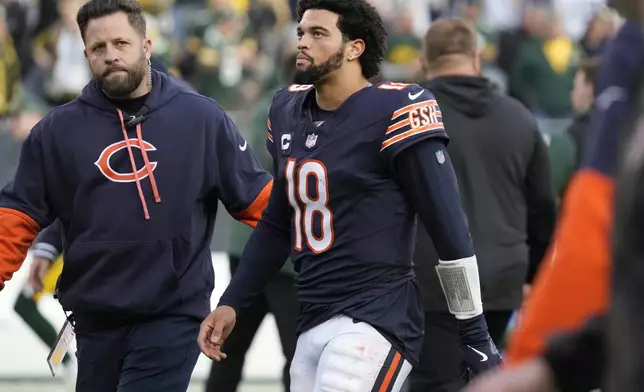 Chicago Bears' Caleb Williams walks off the field after an NFL football game against the Green Bay Packers Sunday, Nov. 17, 2024, in Chicago. The Packers won 20-19. (AP Photo/Nam Y. Huh)