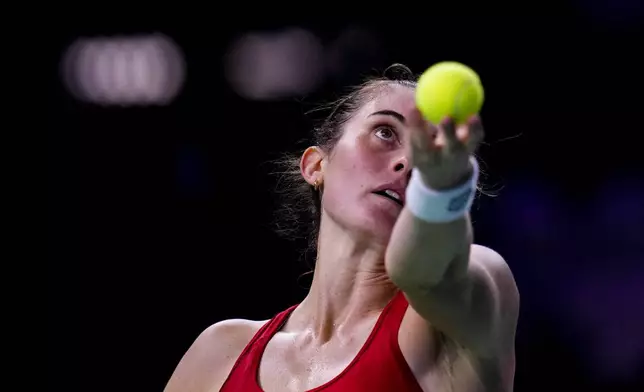 Canada's Rebecca Marino serves against Emma Raducanu of Britain during the Billie Jean King Cup Finals, at the Martin Carpena Sports Hall, in Malaga, southern Spain, on Sunday, Nov. 17, 2024. (AP Photo/Manu Fernandez)